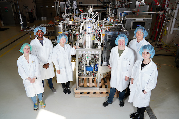 group of students in lab in lab coats